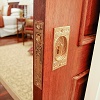 Pocket door with arts and crafts hardware